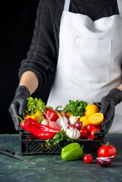 front-view-female-cook-with-basket-full-fresh-vegetables-dark-food-color-meal-salad-kitchen-cuisine